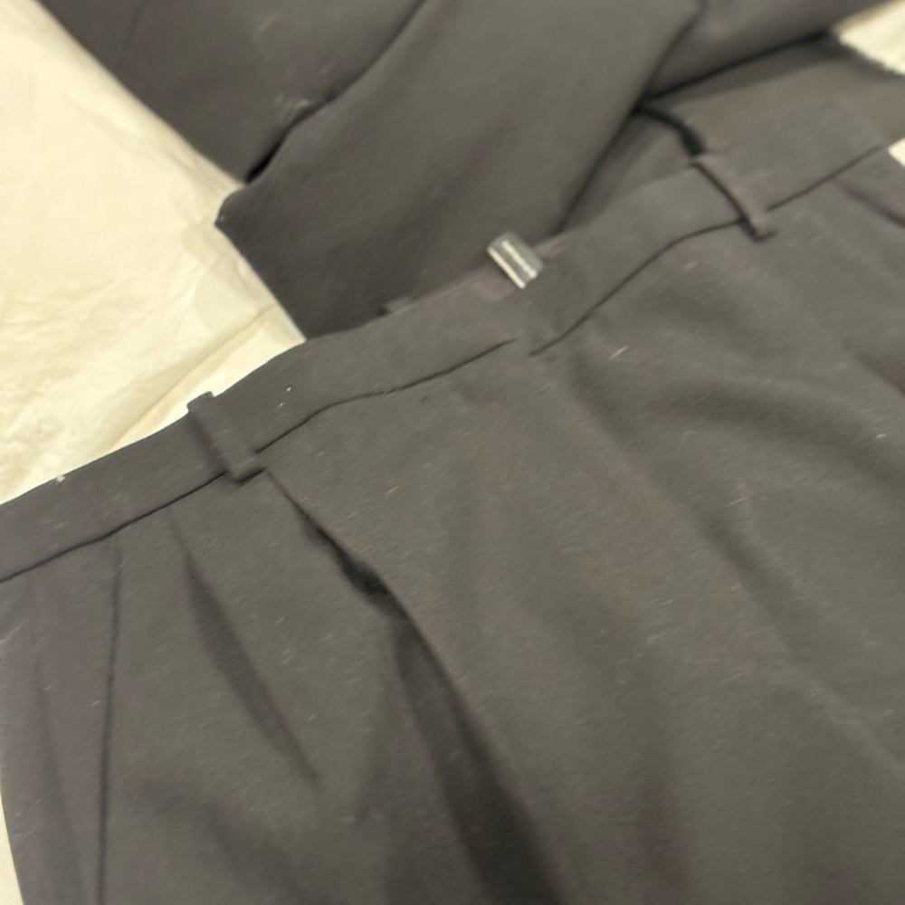 Black pleated pants with satin cuffs